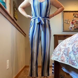 Striped jumpsuit with tie belt